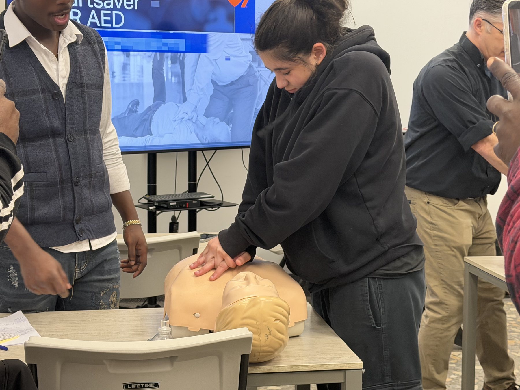 Instructor-led AED and CPR demonstration